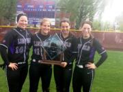 Linfield College softball players Erin Tauscher (Camas), Erin Carson (Camas), Grace Middelstadt (Prairie) and McKenna Spieth (Union), from left, with the 2014 Northwest Conference tournament championship trophy.