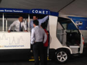 President Barack Obama looks over a Comet electric bus, designed and manufactured by Vancouver-based Pangea Motors, in Manila on Monday.