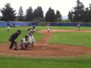 Michael Gonzalez bats for Clark College while Justin Juarez takes a lead off third base Saturday against Mt.