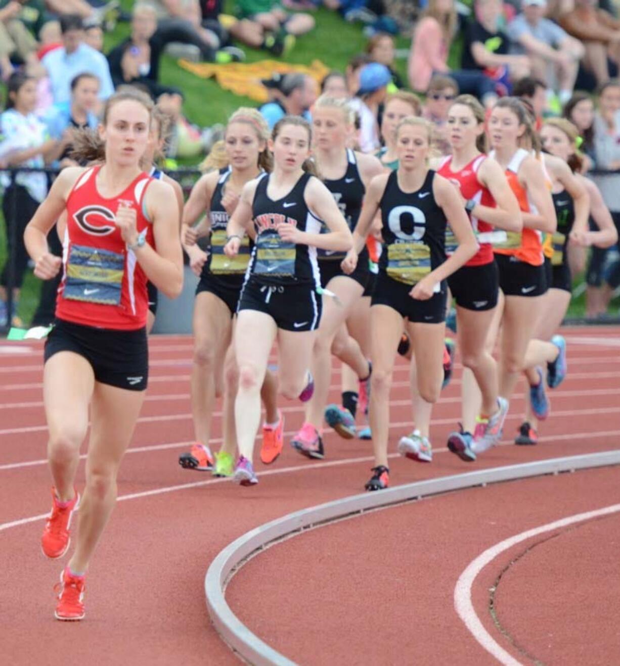 Alexa Efraimson breaks away from the pack during the Jesuit Twilight Elite 1,500-meter race Friday. The Camas High School junior crossed the finish line first with a time of 4 minutes, 21.1 seconds.