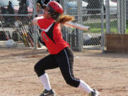 Lena Richards rips a triple into the left field corner April 29, at Camas High School.