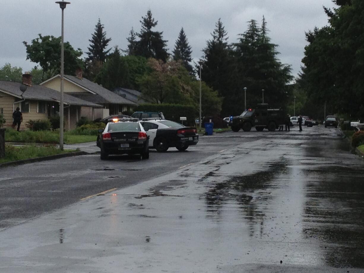 Police surround a house in Vancouver's Marrion neighborhood following a 911 call about a barricaded subject possibly with access to firearms.