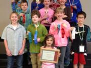 Camas students are all smiles after the recent state science fair. Pictured are front center: Dalilah Cunningham; first row from left:  Eli Burton, Ben Saunders, Alexis Williams, Jaden Le; second row from left:  George Walker, Illaria Cunningham, Mila Smook; back row from left:  Madeleine Sheppard, Emily Sheppard, Bilal Manzer, Chemay Shola.