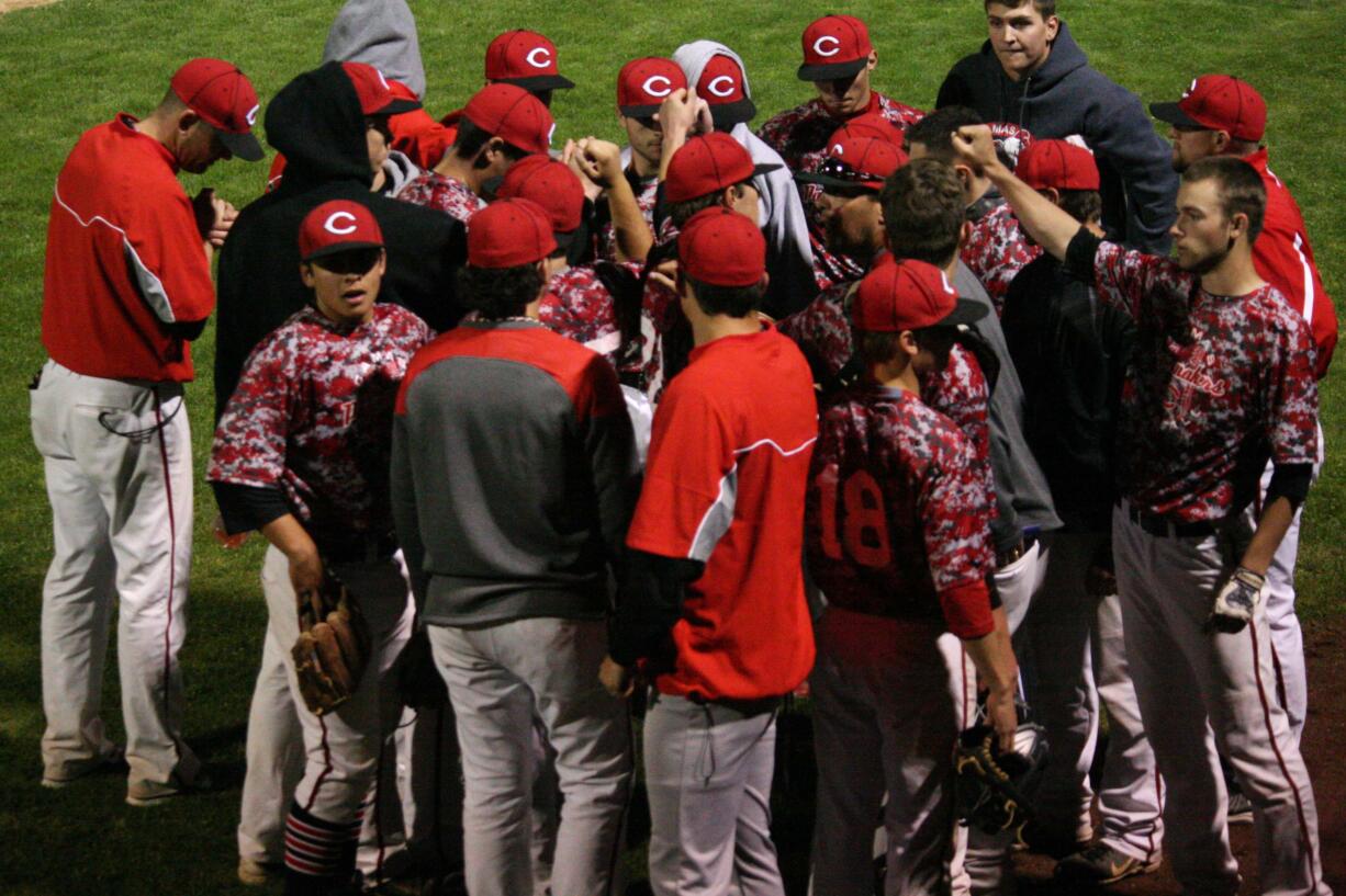 Joe Hallead leads the Papermakers in one more rally cry during the district tournament May 6, at Propstra Park.