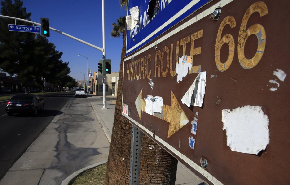 Signs indicating the old route in Barstow reminds motorists of Route 66, &quot;America's Highway.&quot; As the number of tourists attracted by the historic roadway dwindle, merchants along the route must find new ways to attract visitors.