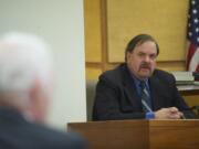 Former Washougal police Officer Robert Ritchie takes the witness stand during his assault trial March 14, 2013, inside Clark County District Judge Sonya Langsdorf's courtroom.