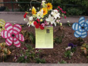 A memorial for teacher Susan Champion has been placed in the flower beds outside the entrance to Hathaway Elementary School.