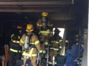 A fire sparked by smoldering smoking material damaged a Salmon Creek garage.