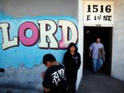 Eliasar Avalos, left, and his sister Angelina wait for their parents March 30 after Pastor Joey Oquendo's service at the Boyle Heights Christian Center in Los Angeles on March 30.