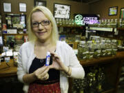 Kari Boiter of Tacoma, state coordinator for Americans for Safe Access, a national medical marijuana advocacy group, visits Rainier Xpress, a medical marijuana dispensary in Olympia. Boiter on Friday praised the U.S. House vote telling the federal government to stay out of states' medical marijuana markets.