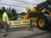 The Camas-Washougal Rotary Club participates in the &quot;Ducky Derby,&quot; an annual fundraiser for the club's various service projects and scholarships. Plastic ducks are tossed off the Third Avenue Bridge in Camas.