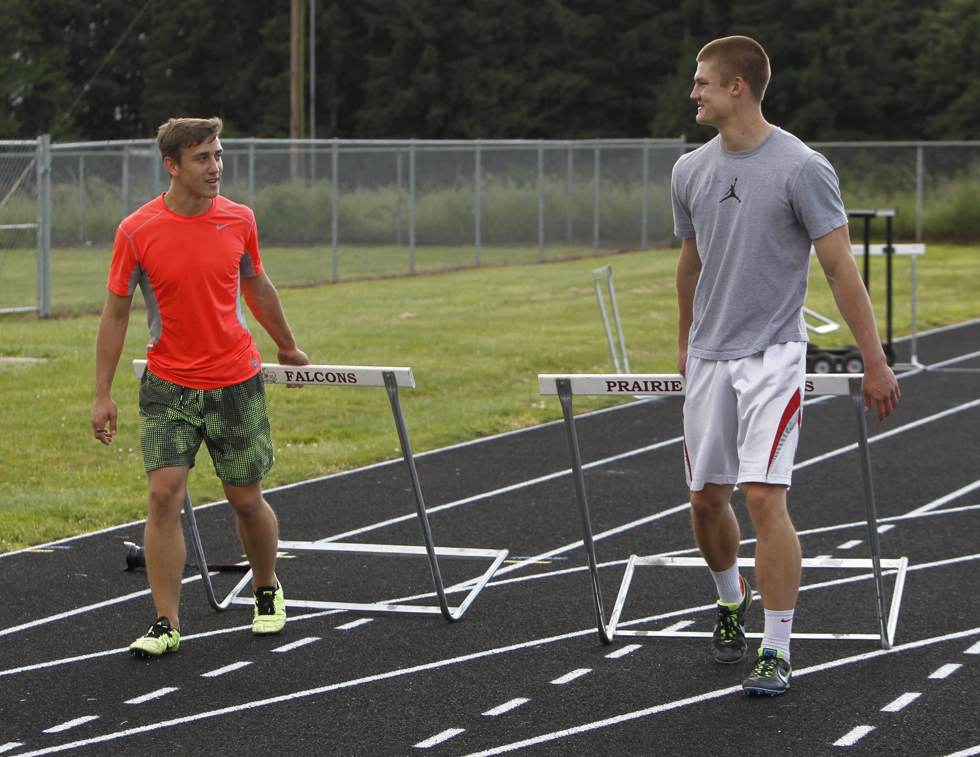 Prairie hurdlers Peter Zalk, left, and James Phillips practice Tuesday.