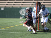 King's Way lacrosse defender Brandon Pearl, right, defends against Seattle Academy in Saturday's high school championship game at Seattle's Memorial Stadium.