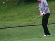 Brian Humphreys chips on to the ninth green during the final round of the 4A state boys golf tournament at Camas Meadows.