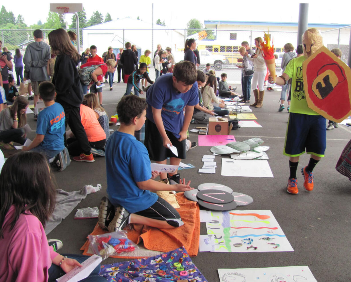 Students sell and buy items during Ancient Market Day, a lively event at Liberty Middle School.