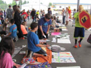 Students sell and buy items during Ancient Market Day, a lively event at Liberty Middle School.