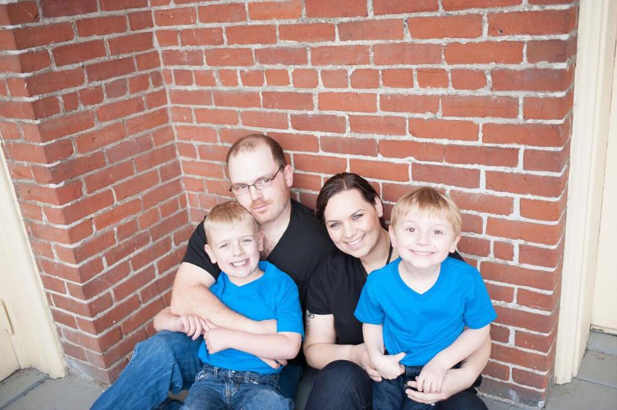 Jack Conover, 7, left; his dad, Kris Anderson; his mom, Kelly Conover and his 4-year-old brother Patrick Anderson.