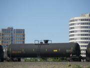 An oil train passes through Vancouver. The Vancouver City Council on Thursday unanimously passed an emergency six-month moratorium on new or expanded facilities that would accept crude oil. The moratorium won't affect the oil transfer terminal proposed by Tesoro Corp.