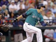 Seattle's Logan Morrison singles in a run as Boston catcher A.J.