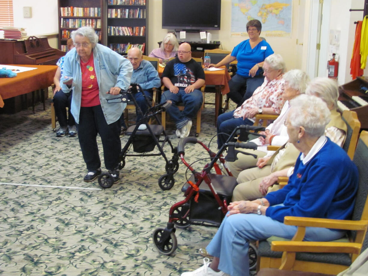 Residents of Columbia Ridge Senior Living, in Washougal, enjoy a game of beanbag baseball. Other activities include exercise classes, walking clubs, ice cream socials, Bible studies, arts and crafts, gardening and music. There are trivia games, reading groups and outings to the beach, local restaurants, museums, special events and concerts.