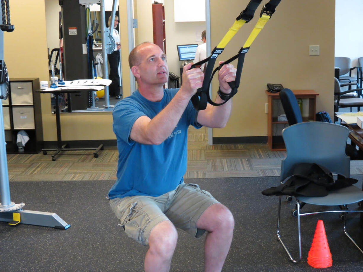 After having spinal fusion surgery, Doug Murray, a City of Vancouver firefighter from Camas, builds strength and flexibility in his back at Washougal Sport &amp; Spine.