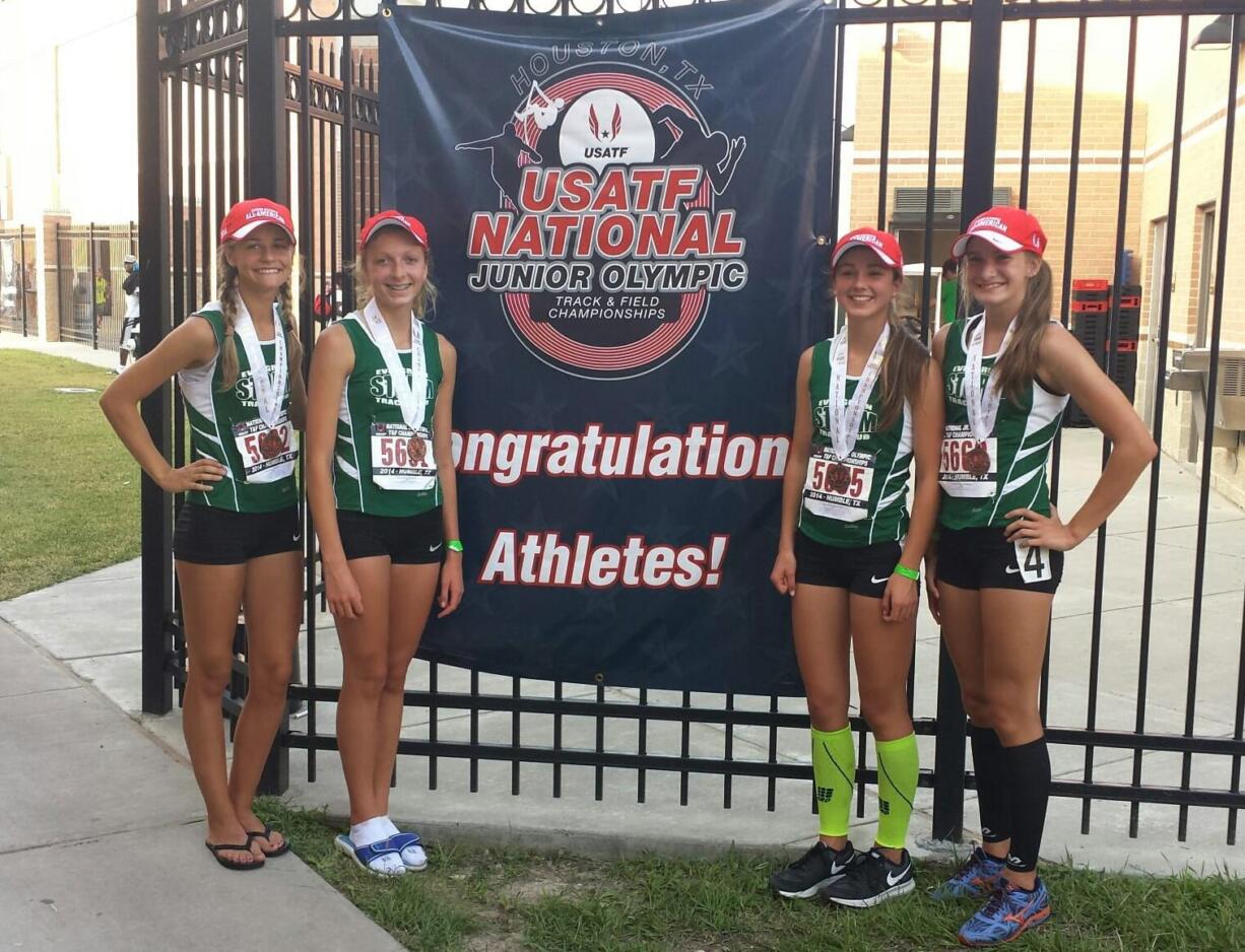 Evergreen Storm Track Club runners Emily Wilson, Brooklyn Jackson, Kaylee Merritt and Presley Timmons (left to right) show off their third-place medals from 3,200-meter relay race July 23, at the National Junior Olympic Championships, in Humble, Texas.