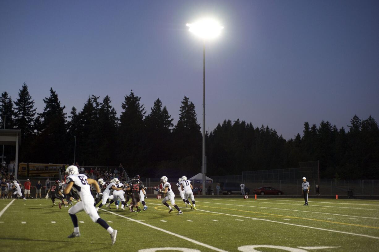 Chiawana runs a play in the first half against Camas at Doc Harris Stadium on Friday September 5, 2014.