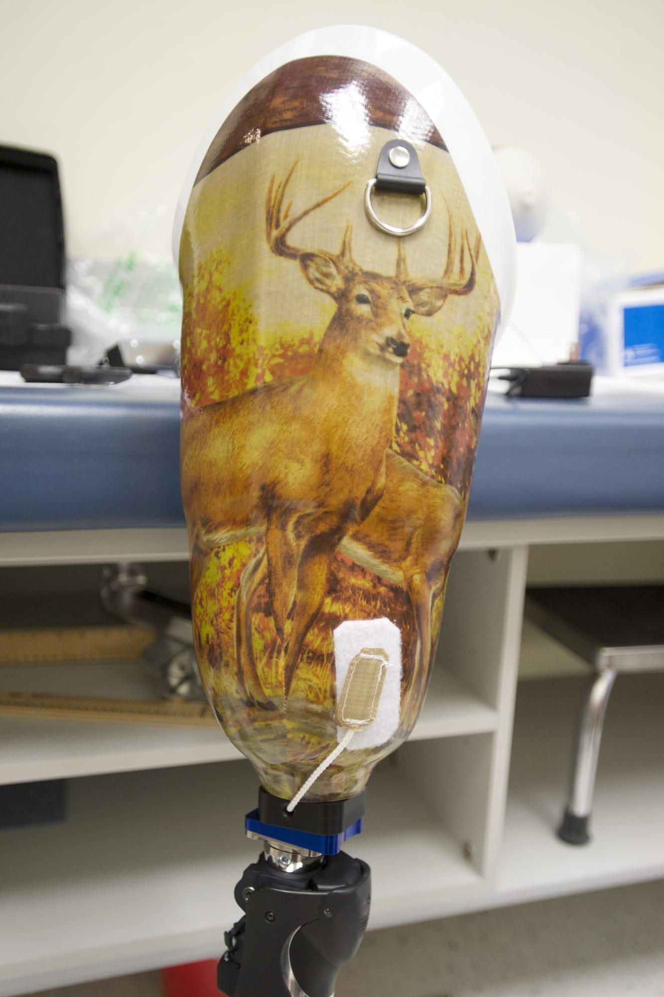 His patients often want to add an artistic personal touch -- an elk image, for example -- to a prosthetic limb, Mark Sauser says.