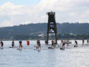 Paddleboarders from all walks of life arrived in Washougal for the first SUP Salmon Classic Sunday, at Capt. William Clark Park. The 8-mile long course challenge featured more than 30 competitors from all around the world. The 4-mile short course and the 2-mile novice race each had 15 participants.