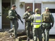 Columbian files
Members of a Clark County SWAT team train in April at a Vancouver home slated for demolition.