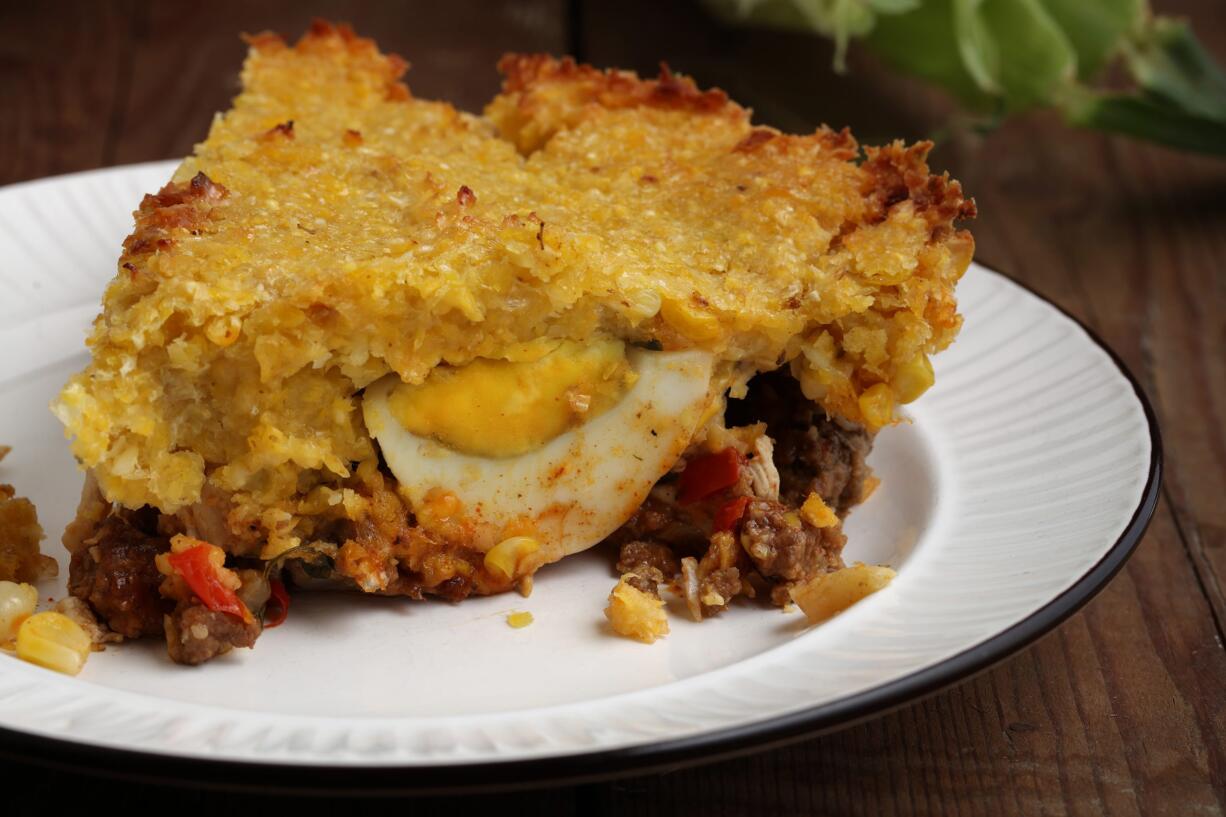 Make a dish inspired by the author's travels to Chile: meat casserole with a sweet corn crust. (E.