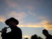 Mitch Rice of Milwaukie, Ore., plays &quot;When Johnny Comes Marching Home&quot; on a fife as a re-enactor in the 1st Oregon Volunteer Infantry during last year's Campfires and Candlelight at Fort Vancouver National Historic Site.