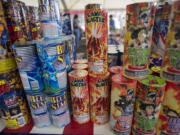 People browse the aisles at a fireworks stand  at Northeast 63rd Street and Andresen Road on July 1, 2012.