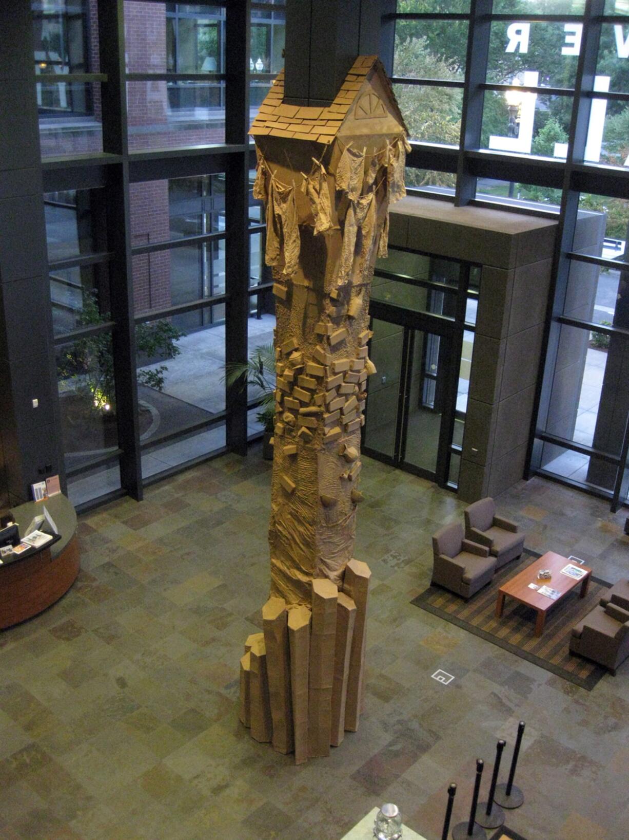 Esther Short: Artist Vicki Lynn Wilson transformed a pillar in the lobby of Vancouver City Hall into a temporary sculpture called &quot;Strata.&quot; The sculpture, along with mixed-media art pieces by Greg Bee, are on display at City Hall until Nov.