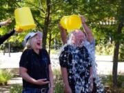 Clark County: Monique and Wes Rice, who run Effective Web Solutions in Washougal, take the Ice Bucket Challenge for the ALS Association during their company's five-year anniversary party on Aug.