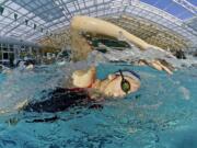 Union sophomore Sophie Carlson swims during practice at the YMCA on Thursday September 4, 2014.