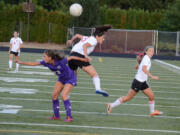 Columbia River's Alexis Dettling, left, vies for the ball with Alyssa Tomasini of Camas in a non-league soccer game Thursday.