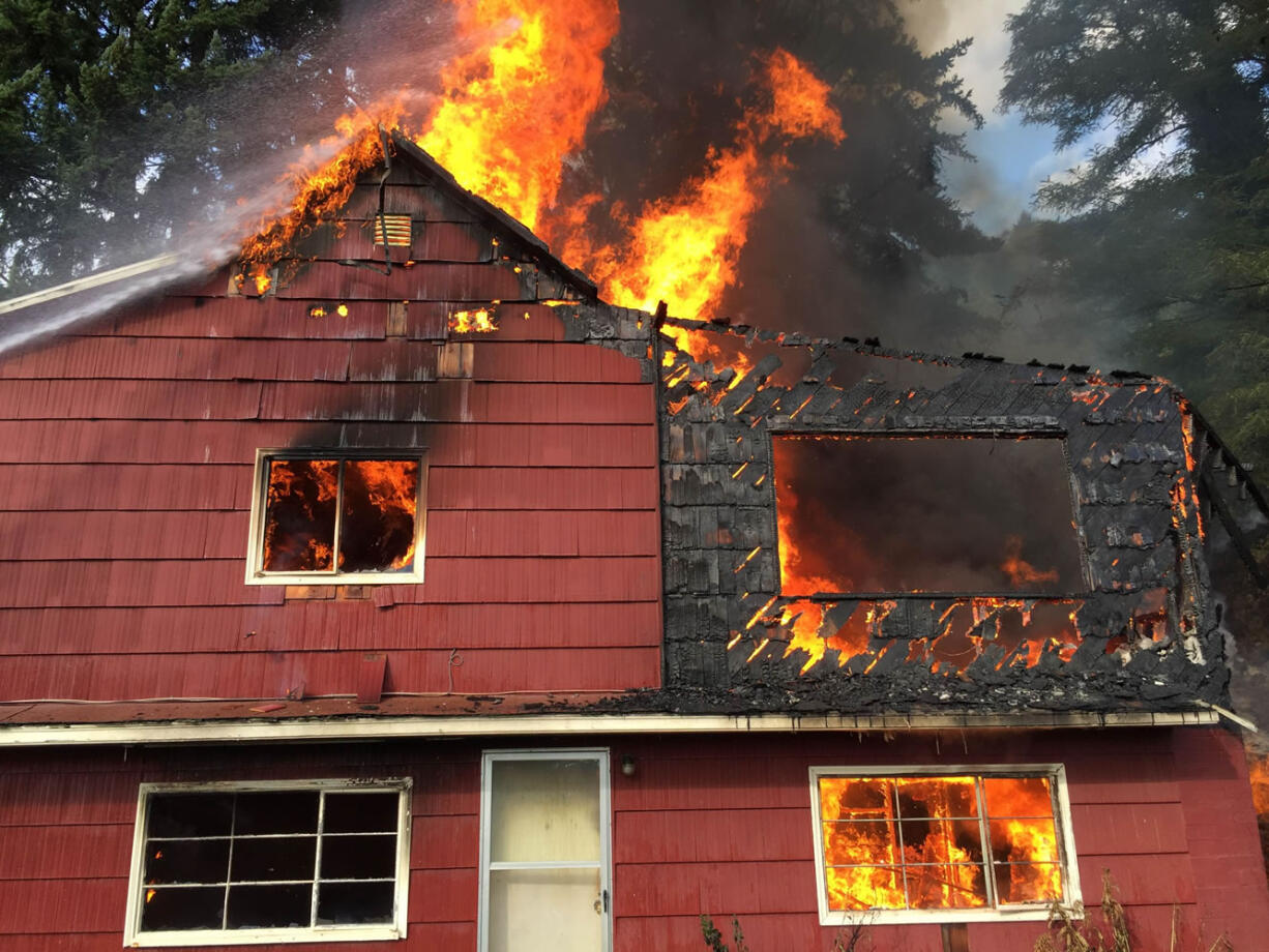 Flames engulf a home on Evergreen Highway in Camas.