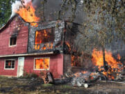 Flames engulf a home on Evergreen Highway in Camas.