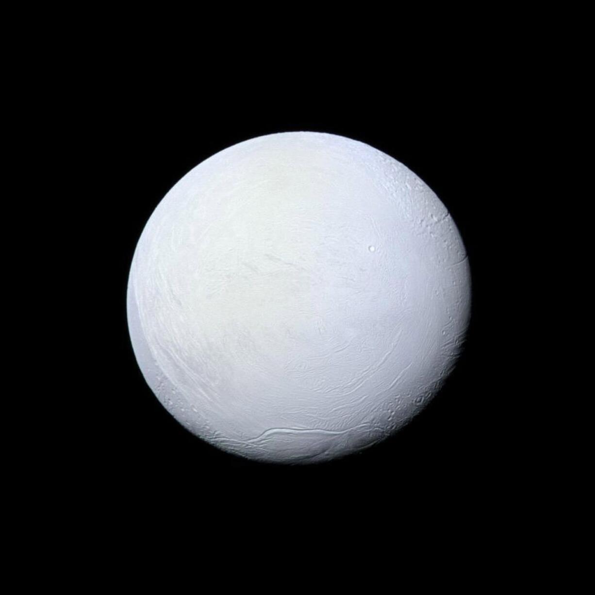 Saturn's moon Enceladus, covered in snow and ice, resembles a perfectly packed snowball in this image from NASA's Cassini mission. Illustrates SATURN (category a), by Rachel Feltman (c) 2015, The Washington Post. Moved Wednesday, Sept. 16, 2015.