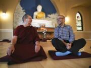 Vimala Bhikkhuni, left, and Tyler Lewke pose for a portrait in the Blue Lotus Buddhist Temple on Sept. 2, 2015 in Woodstock Ill. Buddhist groups can offer lessons in meditation and other teachings to help lead people to sobriety.