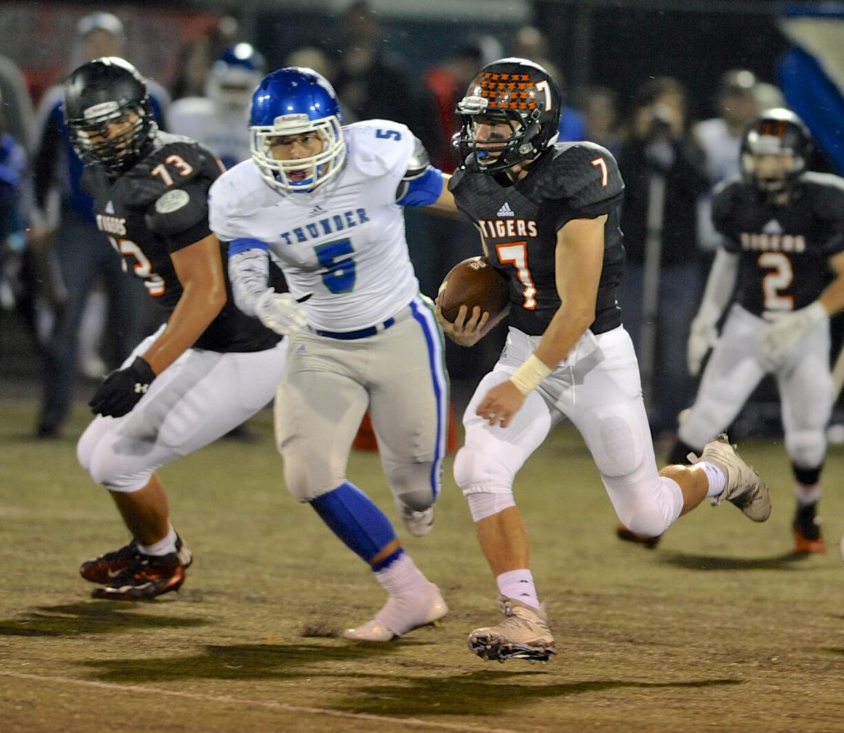 Battle Ground quarterback Gunner Talkington (7) threw for 503 yards and six touchdowns, but relied on his legs for this gain against Mountain View.