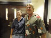 Alan Northrop, left, and Larry Davis celebrate in July 2010 outside a Clark County courtroom after a Superior Court judge dismissed charges against them in a 1993 rape conviction on the basis of new DNA evidence that pointed to different assailants.