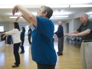 Linda McKenzie, 65, participates in a Tai Chi class for seniors at Touchmark at Fairway Village in Vancouver.