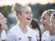 Camas senior Mason Minder takes her role as team captain seriously as she gets the team pumped up for a recent match against Evergreen.