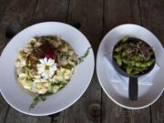 A plate of adult mac and cheese, left, is seen next to roasted edamame at Barrel Mountain Brewery in Battle Ground on Friday afternoon, Sept. 18, 2015.