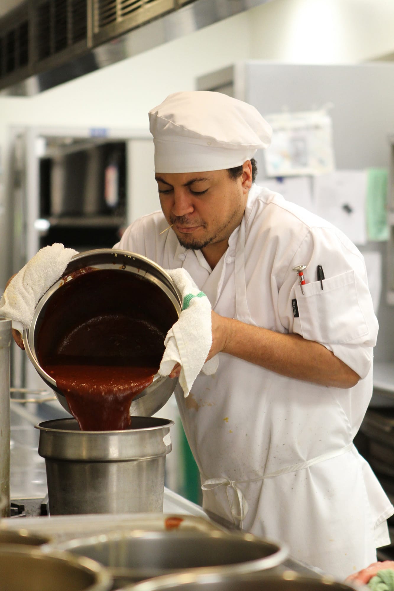 Clark College culinary art student Louis Cayson prepares tomato soup in the cafeteria's kitchen in March 2013. The food program is undergoing a redesign that will change the curriculum and the physical space of the kitchen and the dining area.