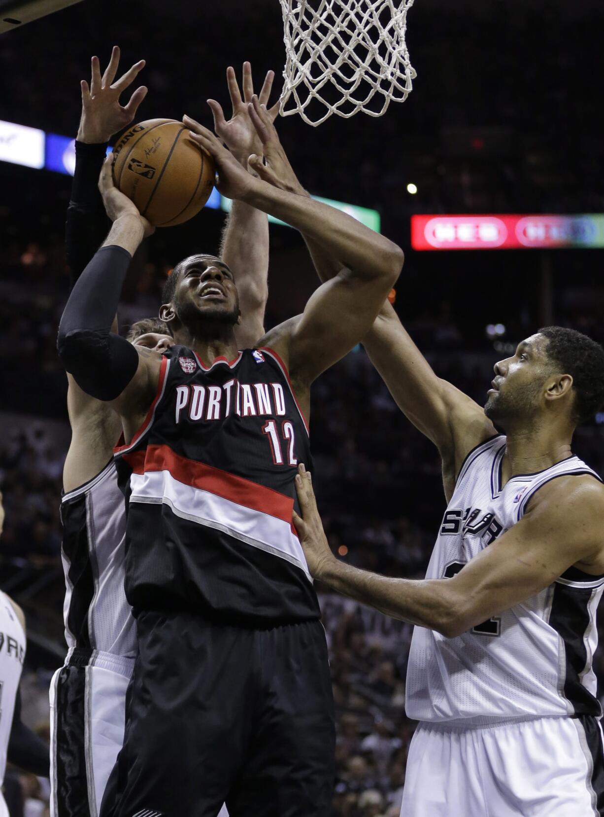 Portland's LaMarcus Aldridge (12) and the Blazers had it rough against San Antonio in the playoffs last season.