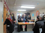 Carol Boyden, principal at Excelsior High School, talks with Washougal residents about the needs of the aging facility during a tour Friday.