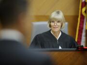 Judge Barbara Johnson checks with attorneys before starting up an afternoon court session in 2012. Presiding Judge Johnson received her law degree from the University of Washington Law School and was admitted to the bar in 1975. She was sworn in as the first female Superior Court judge for Clark County in January 1987.